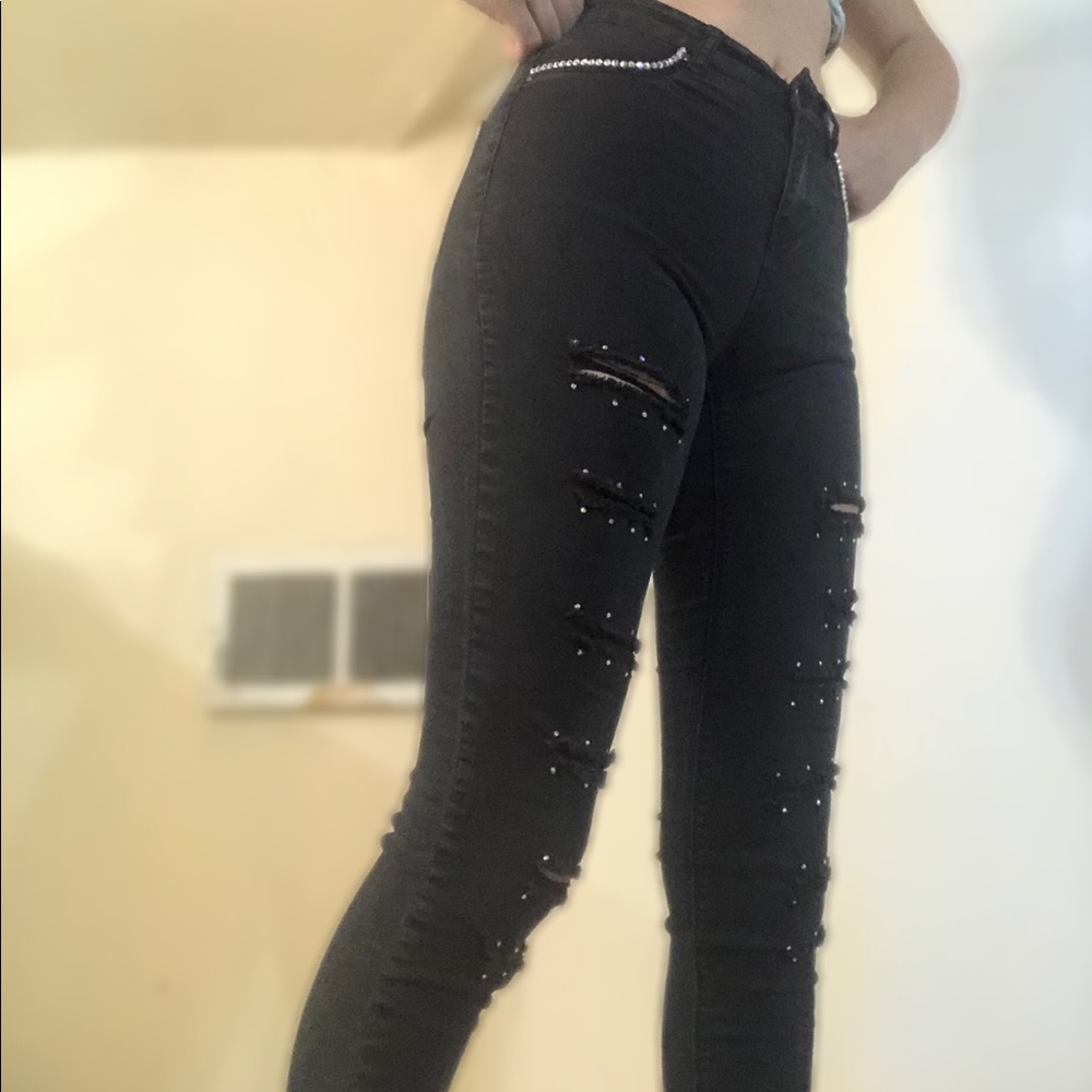 Dark bedazzled ripped jeans